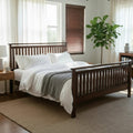 MissionCraft Furniture Atena solid walnut hardwood platform bed with slatted headboard and footboard in a bedroom