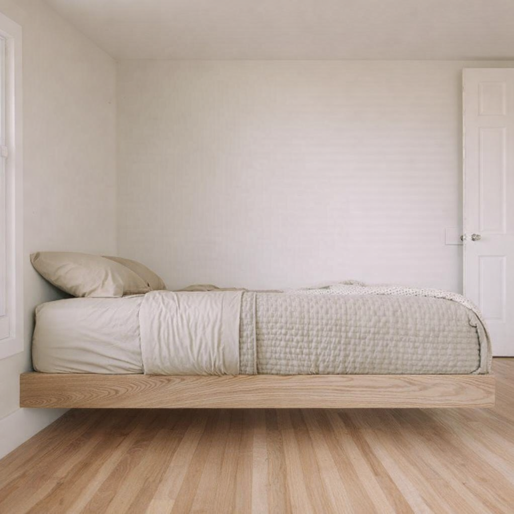 MissionCraft Furniture Basic Floating Bed in light hardwood with a minimalist recessed base in a modern bedroom.