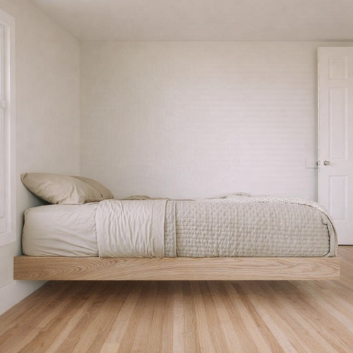 MissionCraft Furniture Basic Floating Bed in light hardwood with a minimalist recessed base in a modern bedroom.