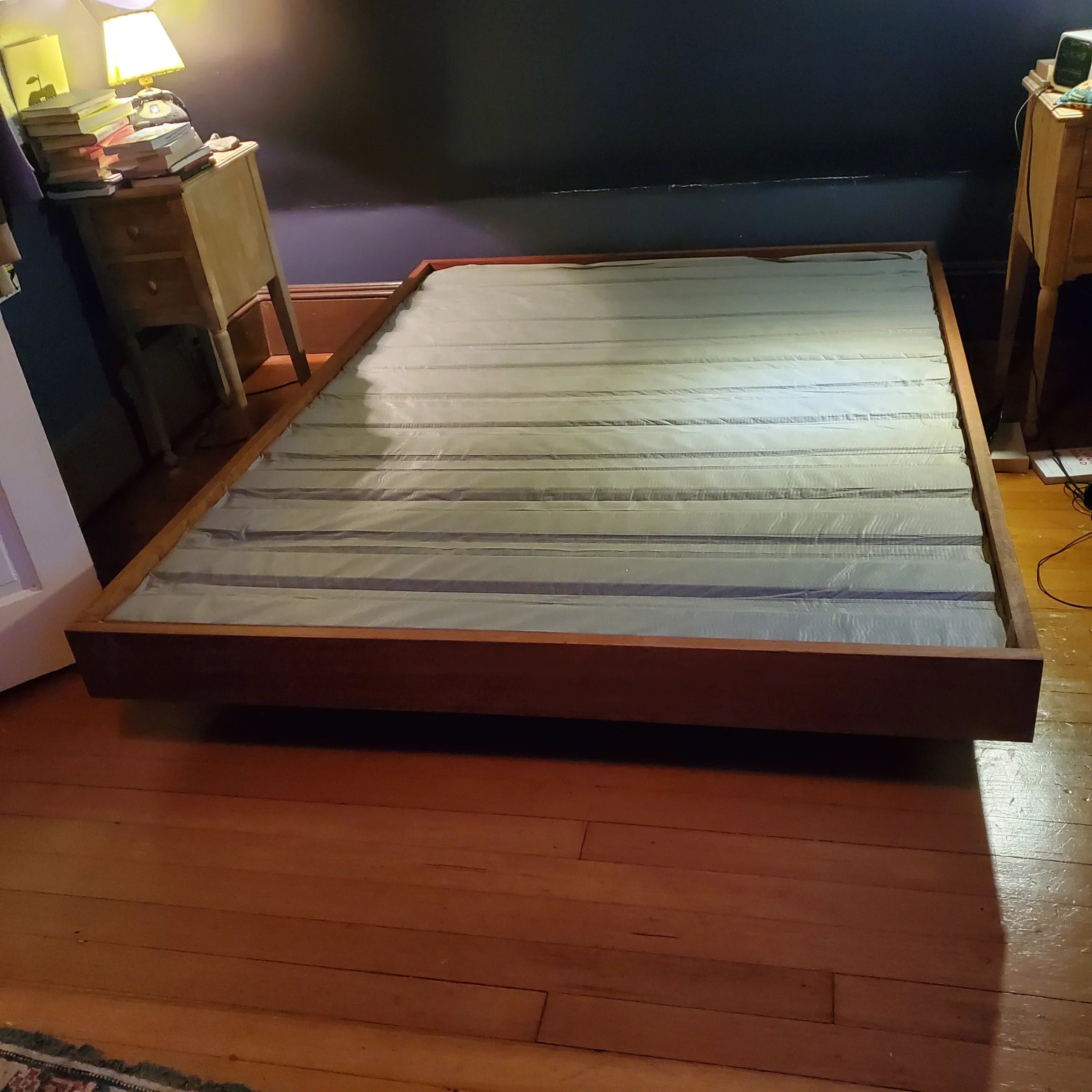 MissionCraft Furniture Basic Floating Bed with a minimalist solid hardwood platform and recessed base in a bedroom.